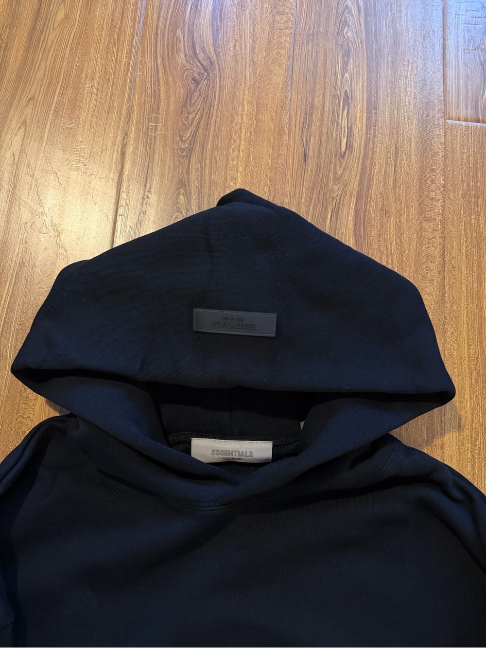 Essentials Men's Black Pullover Hoodie with Subtle Logo Patch